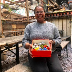 Person sitting with box of crafts