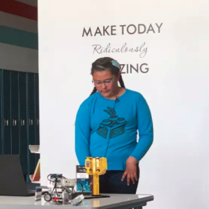 Abigail Cota, a member of the Shoshone, Paiute, and Tlingit tribes and student at the Duck Valley Indian Reservation's Owyhee Combined School, demonstrates Lego robots for the Native Voices in Idaho project.