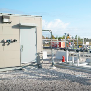 Power plant with yellow banner reading, "Clean hydrogen enters the Markham energy mix"
