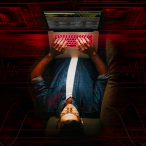Aerial view of man typing on a laptop