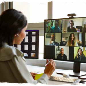 a woman looking at her computer screen on a video call