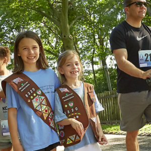 Group of people smiling and walking