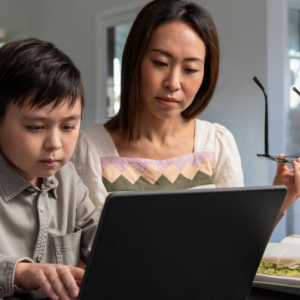 Parent and child using a laptop