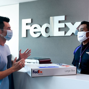 FedEx employee helping a customer