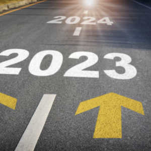Road with arrows pointing from 2023 to 2024