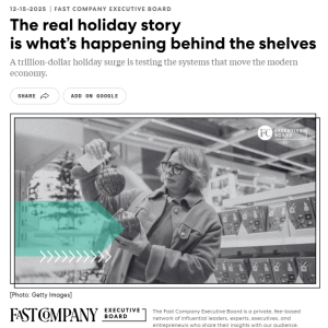 A shopper examines holiday ornaments on a store shelf, illustrating how record retail demand places pressure on supply chains during peak season.