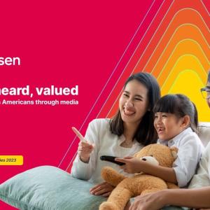 Nielsen: Seen, heard, valued. Asian family shown watching TV.