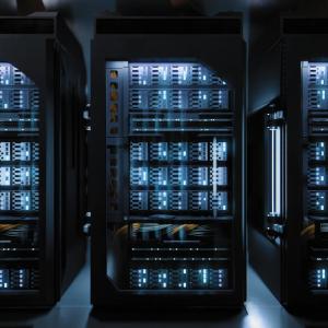Server racks inside a modern data center, housing high-density computing equipment used for cloud computing and AI workloads.