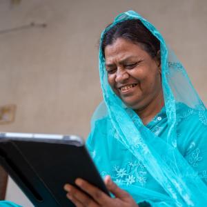 Photo of Shahjahan using her digital tablet.