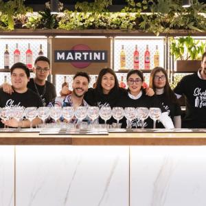 A group of 'Shake Your Future' students stood behind a bar