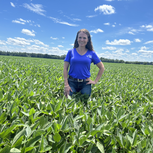 Woman standing in soybean field