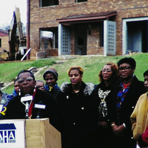 man speaking at podium