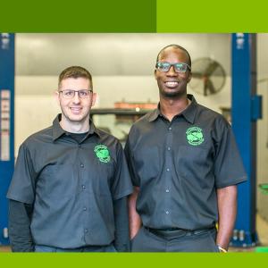 Shawn McHargue and Larry Witherspoon in mechanics uniforms