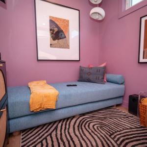 Photo of a SheCare Wellness Pod with a couch, easy chair and art on the walls.