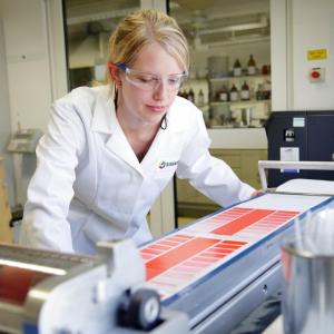 Person in a lab looking at color palettes 