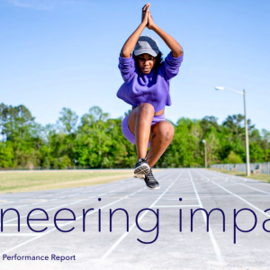 person jumping with 'Engineering impact'