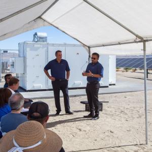 Jared Haines, CEO of Catalyze (left) and Josué Quintanilla, Catlyze's director of project management, discuss the Sheep Creek Community Solar Farm project at a ribbon-cutting ceremony earlier this month. 