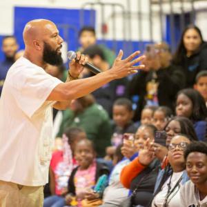 A person speaking in front of an audience 