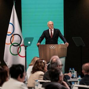 A speaker stood at a podium in front of an audience