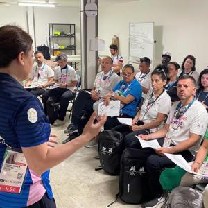 Speakers stood in front an audience 