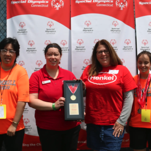 People standing with award
