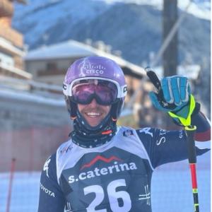 Spencer Wood in ski attire, waving at the camera