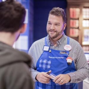 Sore associate at Bath & Body Works speaking to a customer