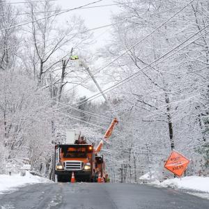 Power crews out restoring downed power lines after a storm.