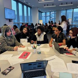 Students gathered around a table at Career Discovery Week at Tapestry HQ