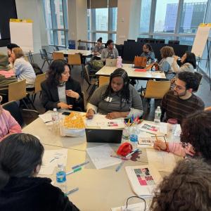 Students gathered around a table at Career Discovery Week at Tapestry HQ