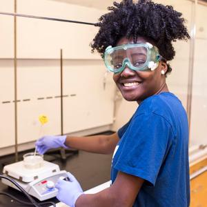 A student wearing safety goggles 