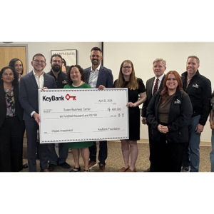 group holidng up a check