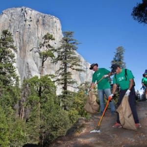 people cleaning up a trail