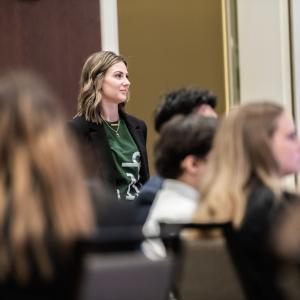 intern standing in crowd