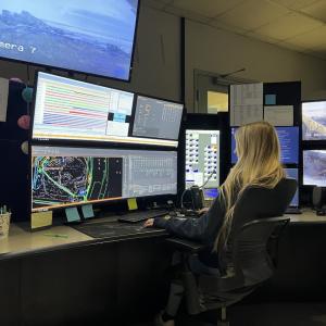 Kriste McCann sitting in front of computers
