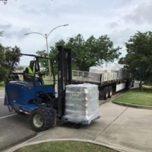 pallet of packaged supplies being moved