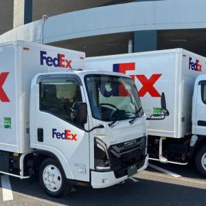 Two FedEx trucks