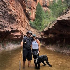 Photo of Suzeth Campos, her husband and dog taking a hike.
