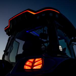 tractor's orange running lights at early dawn