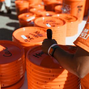 Buckets being labeled for disaster relief.