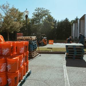 Buckets stacked on pallets; waiting to be loaded onto trucks.