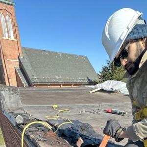 A construction worker on a roof 