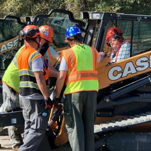 CNH employees with equipment