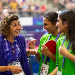 Otis volunteer with table tennis players