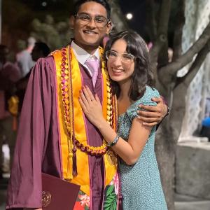 Tanishq and a young woman at his graduation. 
