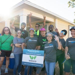 Team Wesco shown in front of the house that they worked on during the ream build.
