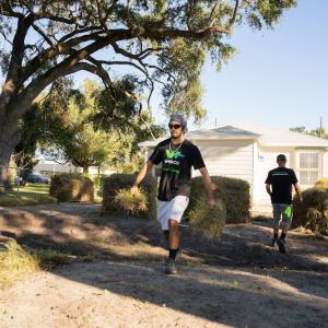 Wesco volunteers performing landscaping.