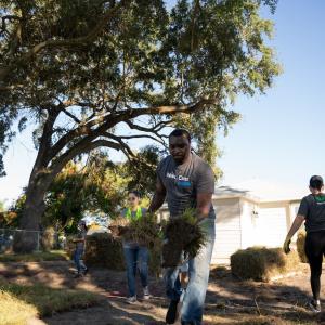 Wesco volunteer doing landscaping.