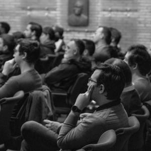 black and white photo of CNH colleagues attending the Team Innoptus presentation