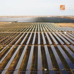 Field of solar panels shown from overhead with The Home Depot Logo.